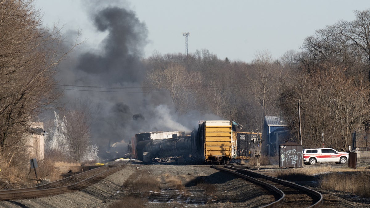 Smoke rises from a derailed cargo train in East Palestine, Ohio, on February 4, 2023. - The train accident sparked a massive fire and evacuation orders, officials and reports said Saturday. No injuries or fatalities were reported after the 50-car train came off the tracks late February 3 near the Ohio-Pennsylvania state border. The train was shipping cargo from Madison, Illinois, to Conway, Pennsylvania, when it derailed in East Palestine, Ohio. (Photo by DUSTIN FRANZ / AFP) (Photo by DUSTIN FRANZ/AFP via Getty Images)