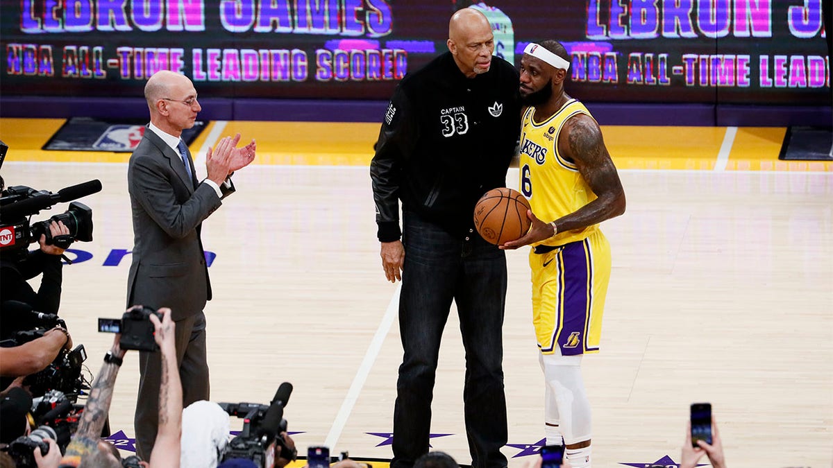 LeBron James, and Kareem Abdul-Jabbar embrace