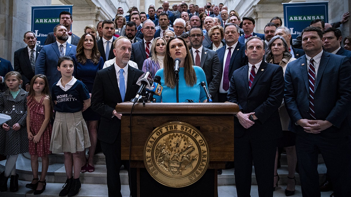 Sarah Huckabee Sanders speaking at the Arkansas state capital.