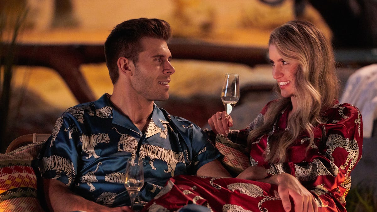 Zach Shallcross in a patterend shirt with Kaity Biggar holding a wine glass on "The Bachelor"