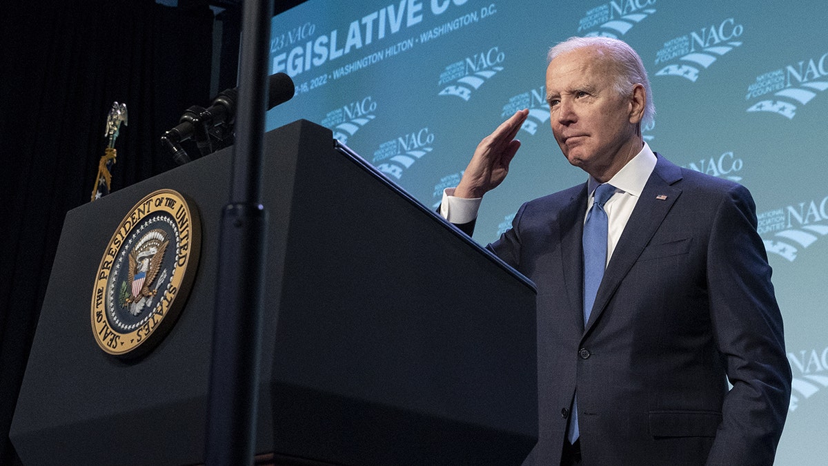 Biden saluting