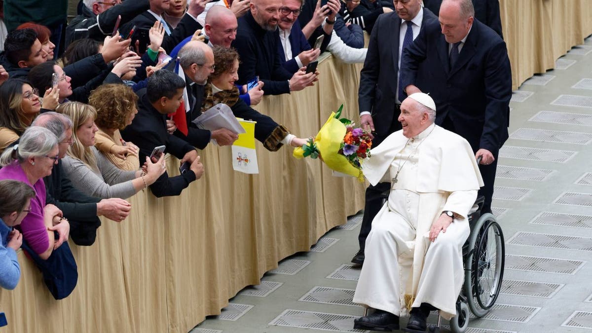 Pope Francis greets Catholics