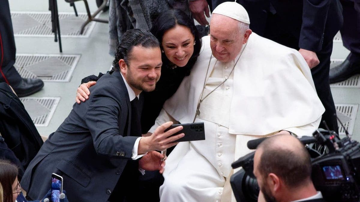 Pope Francis poses for a selfie