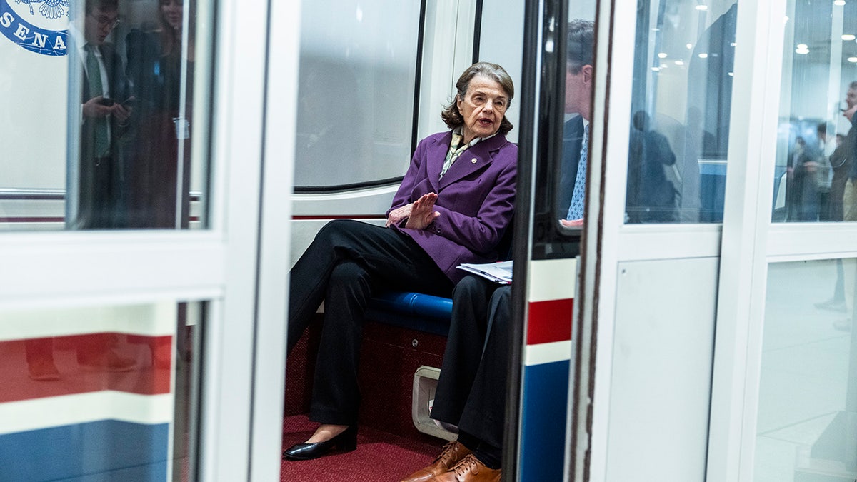 Sen. Dianne Feinstein sits on a subway