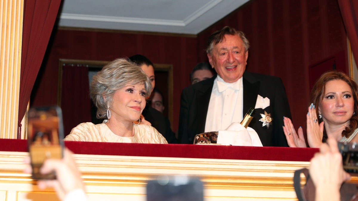 Jane Fonda seated watching event with Richard Lugner