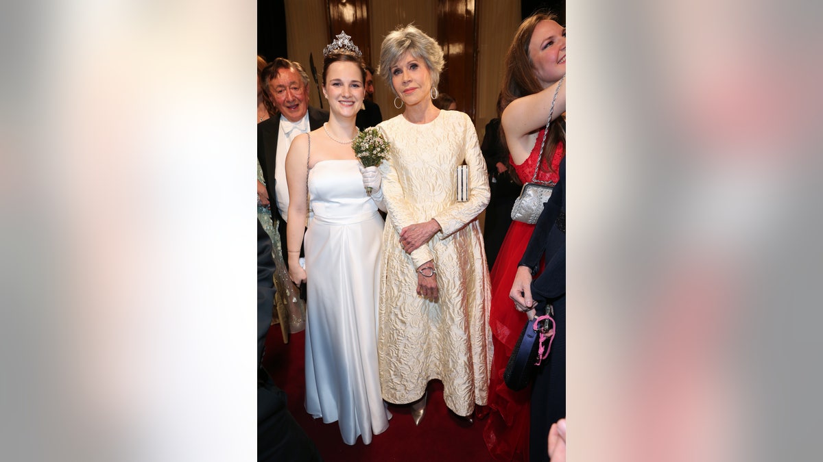 Jane Fonda with young woman both wearing white