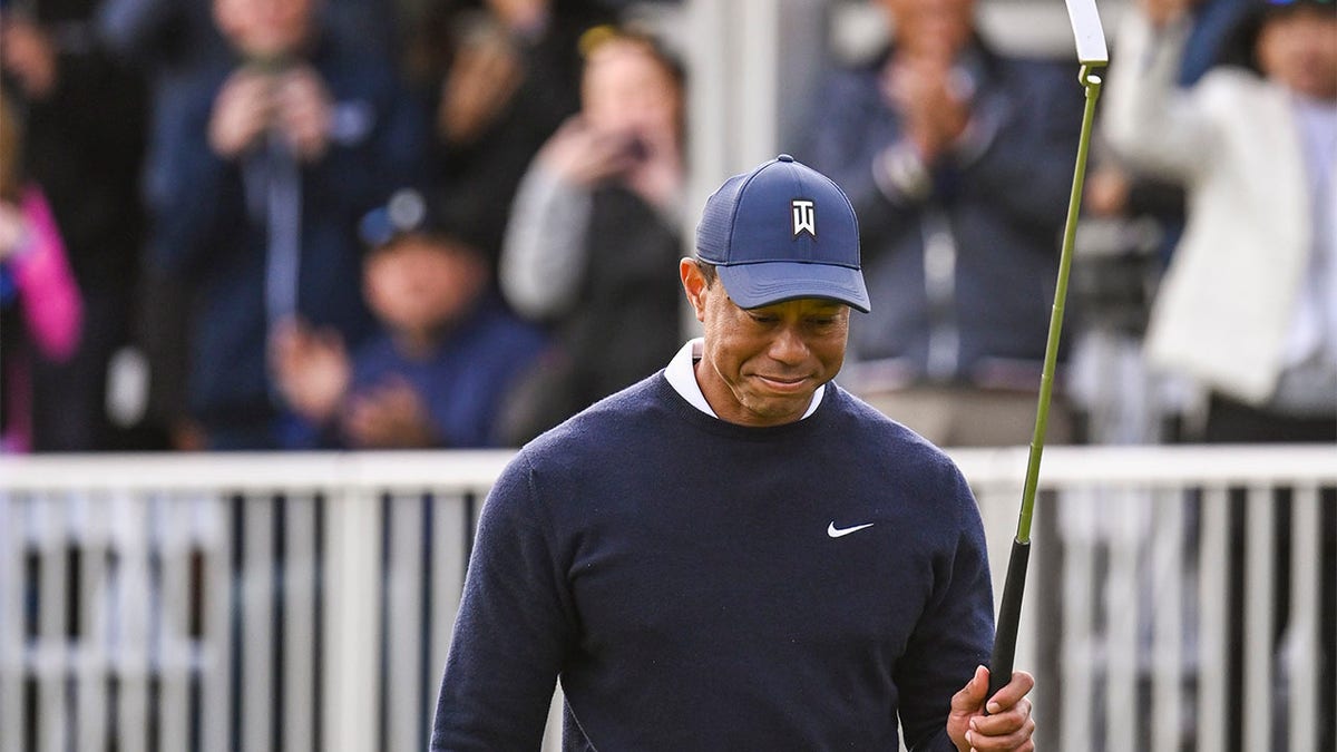 Tiger Woods acknowledges the crowd on Thursday