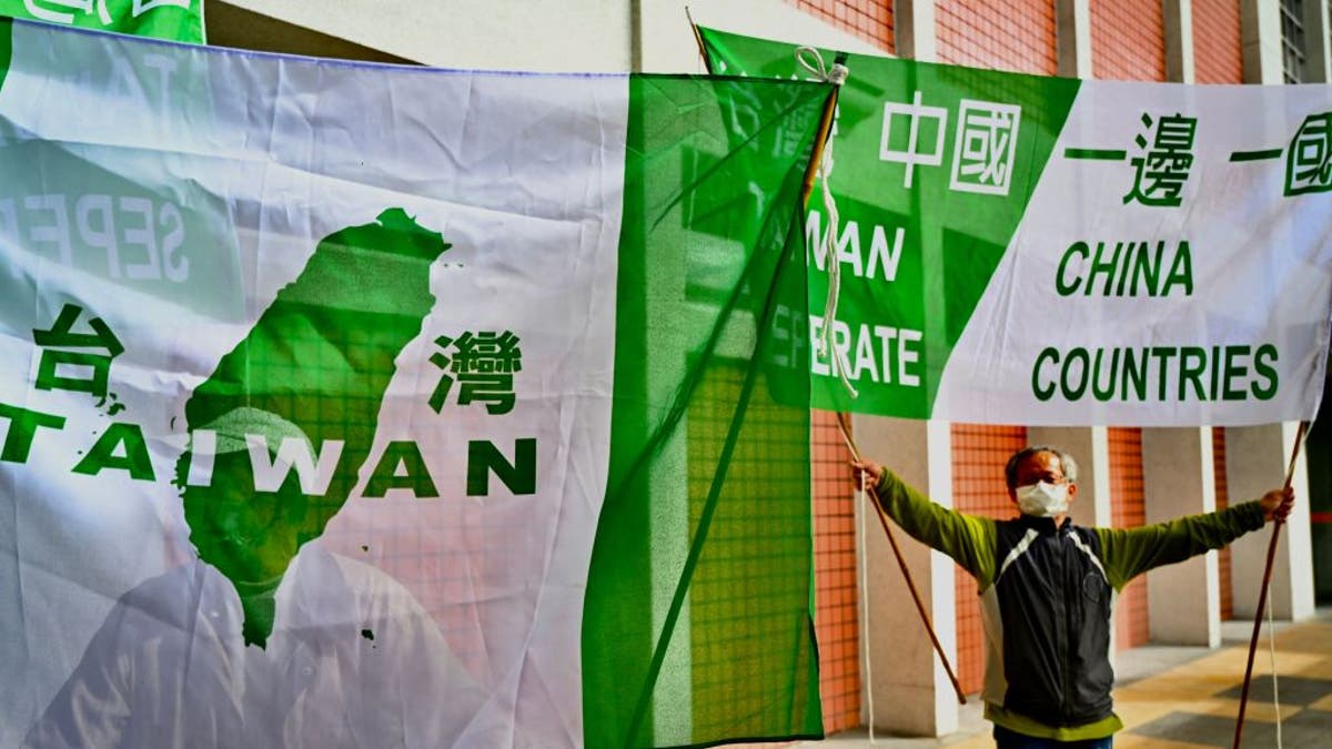 Pro-Taiwan independence activists display banners