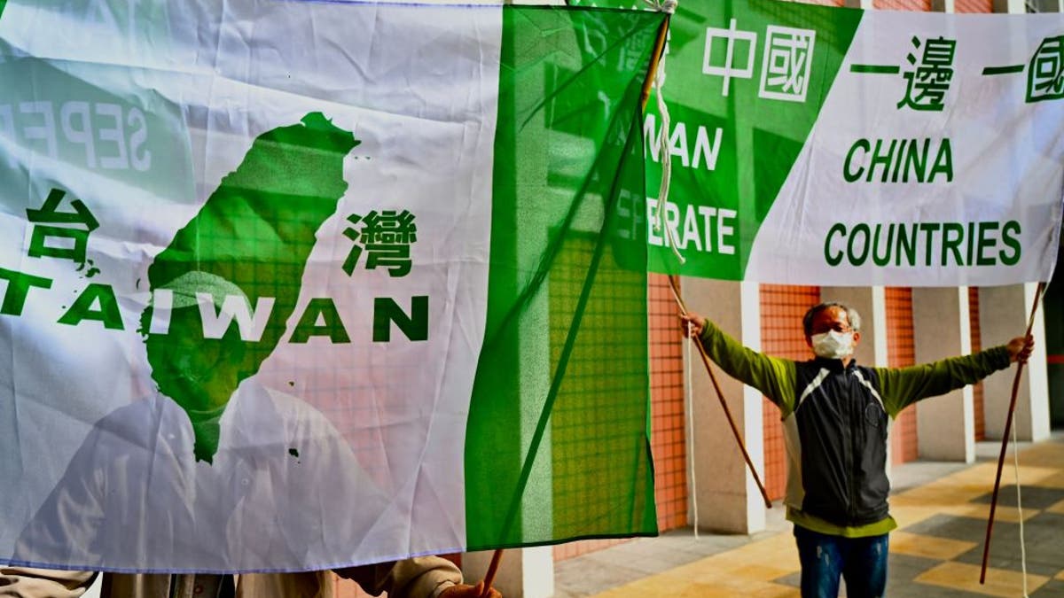 Pro-Taiwan independence activists display banners