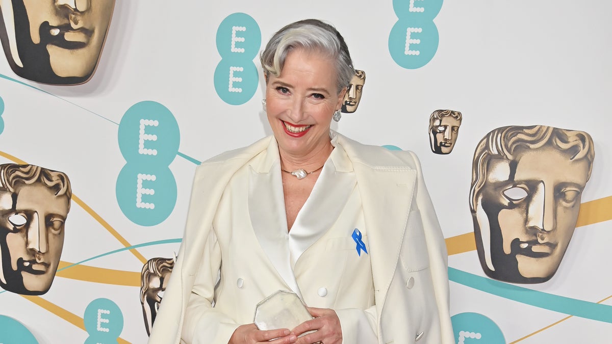 Emma Thompson wears a white suite