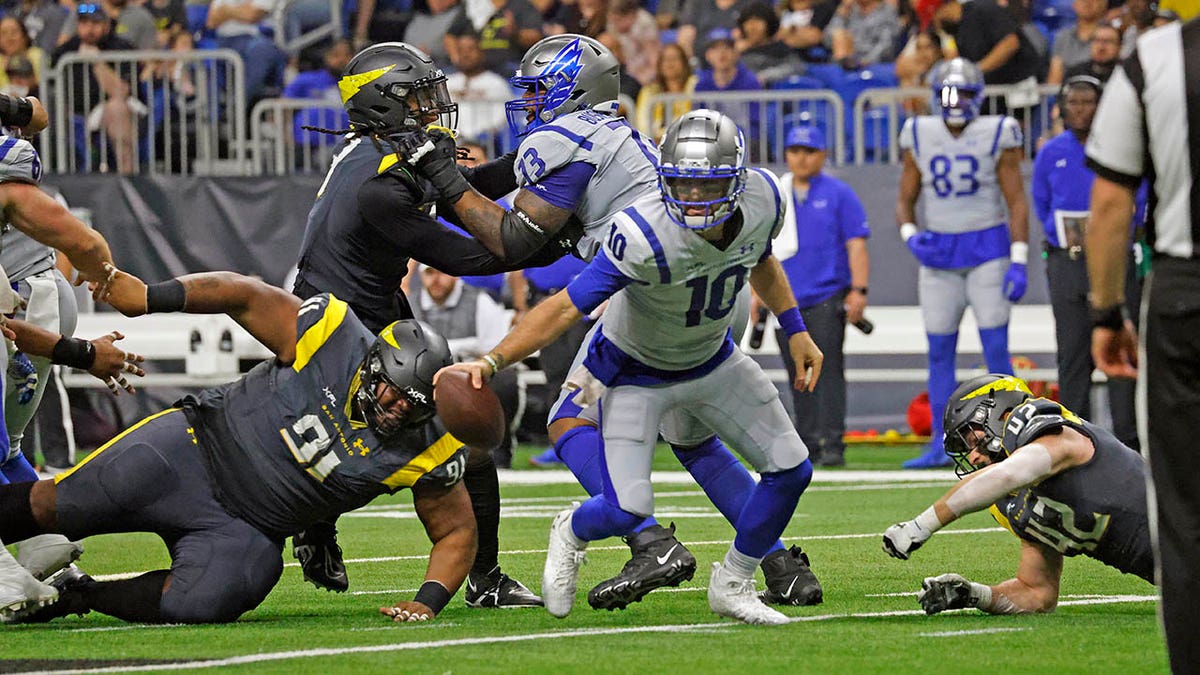 A.J. McCarron scrambles in an XFL game