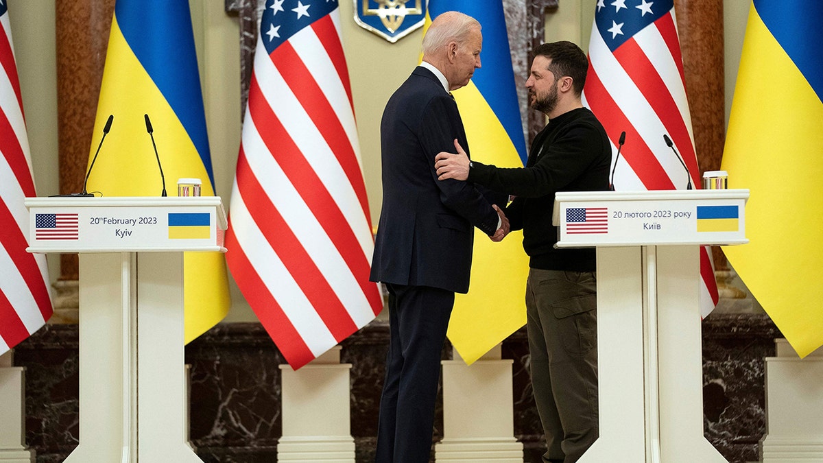 Joe Biden shaking hands with Zelenskyy
