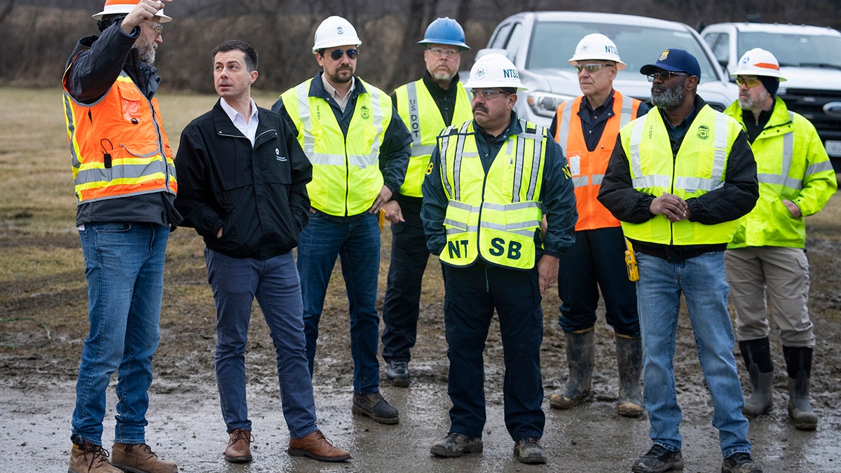 Pete Buttigieg with other officials