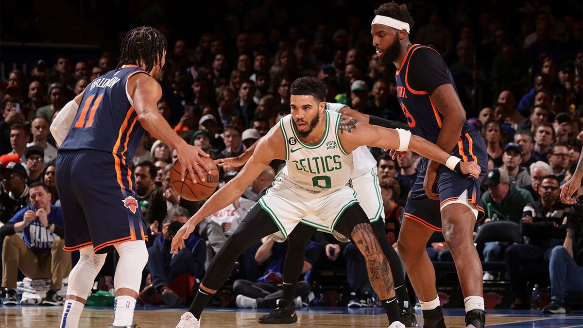 Jayson Tatum plays defense against the Knicks