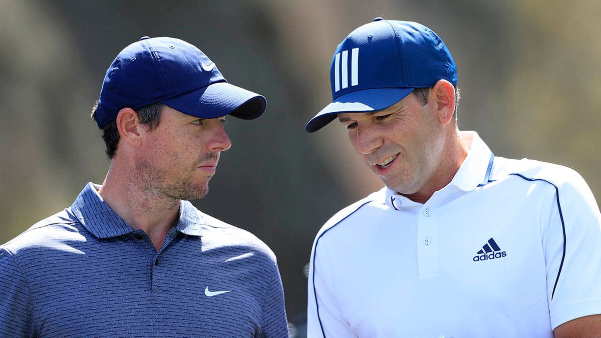 Rory McIlroy talks to Sergio Garcia