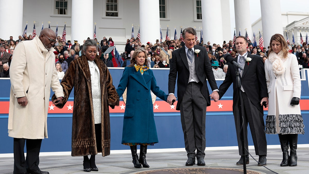 Jason Miyares, second from right, with Gov. Youngkin, center, on inauguration day 2022