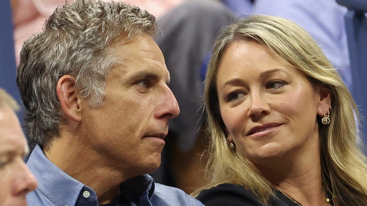 Christine Taylor looks at husband Ben Stiller in the crowd of the US Open in 2022