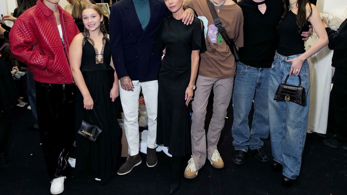 Cruz Beckham, Harper Beckham, David Beckham, Victoria Beckham, Romeo Beckham, Brooklyn Peltz Beckham and Nicola Peltz Beckham attend the Victoria Beckham Spring/summer 2023 Runway show in Val-de-Grace on September 30, 2022 in Paris, France. 