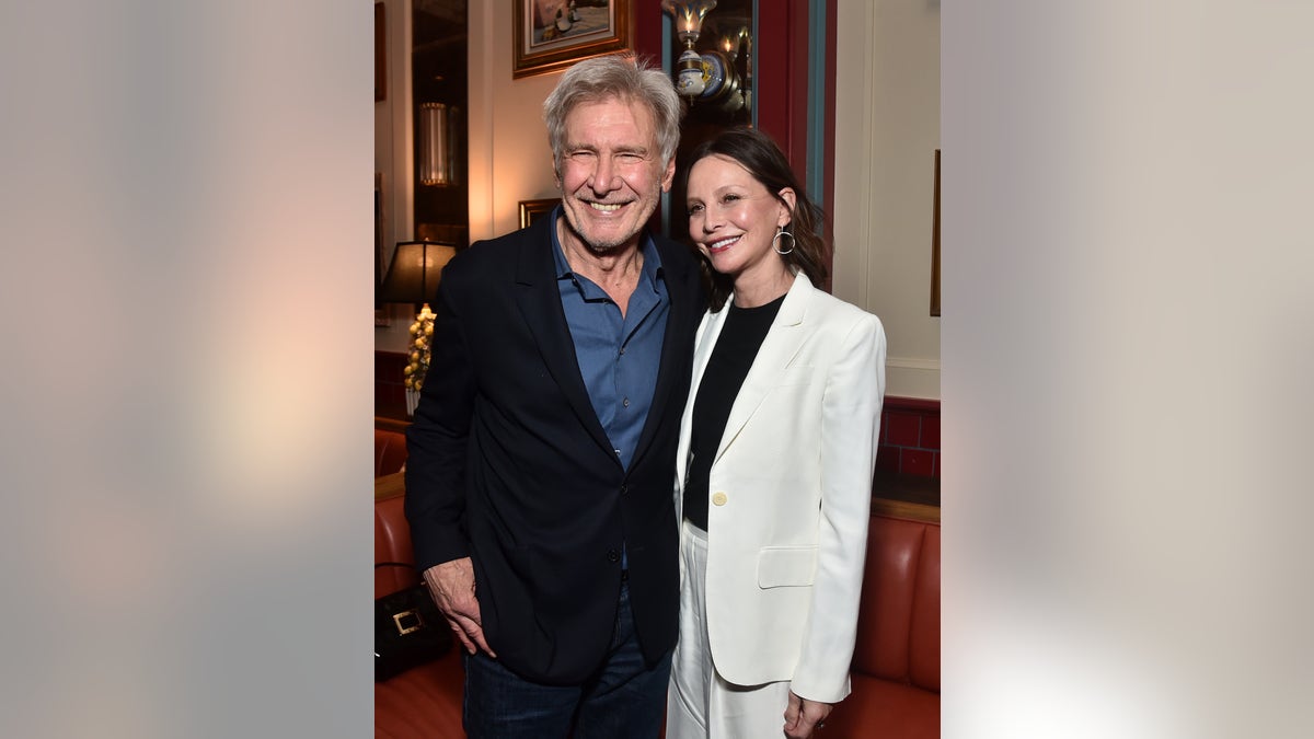 Harrison Ford and wife Calista Flockhart smile together at a screening of "1923"