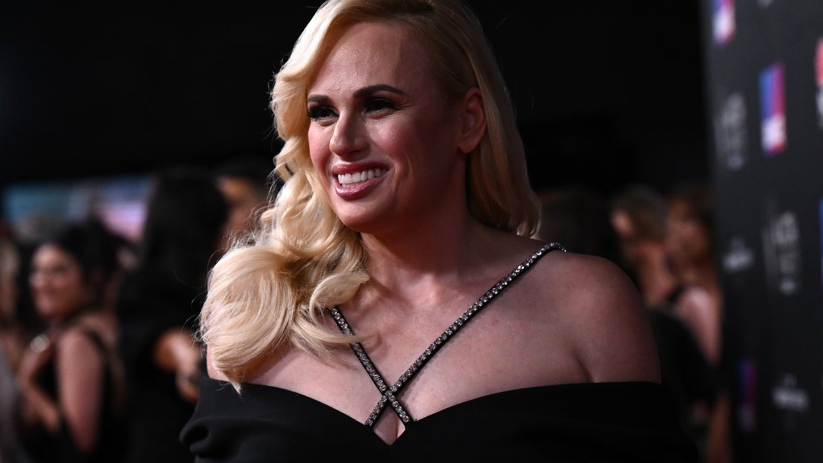 Rebel Wilson in a black dress