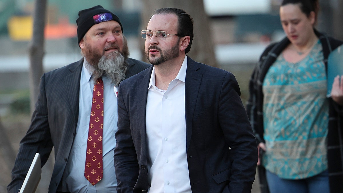 Proud Boys member Dominic Pezzola's attorneys arrive to court