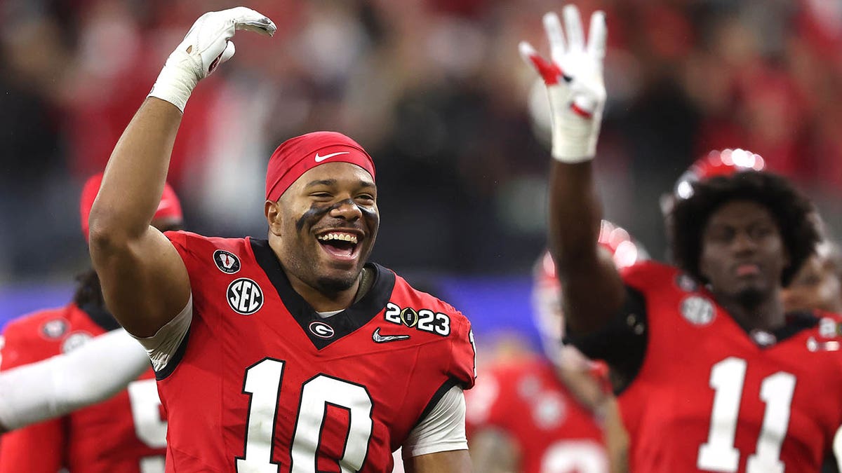 Jamon Dumas-Johnson celebrates winning the national championship game