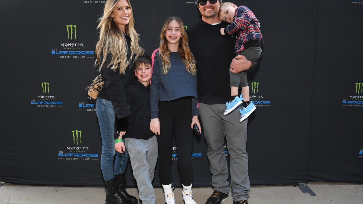 Christina Hall poses with her children and husband Joshua Hall