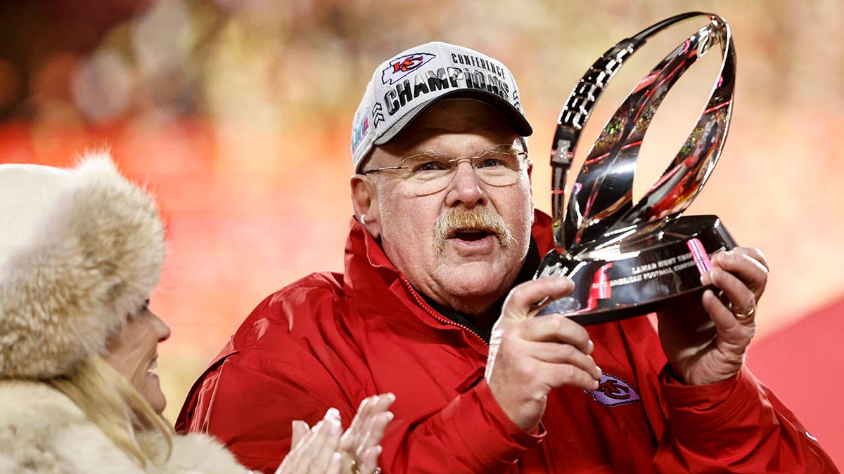Andy Reid celebrates with the Lamar Hunt Trophy