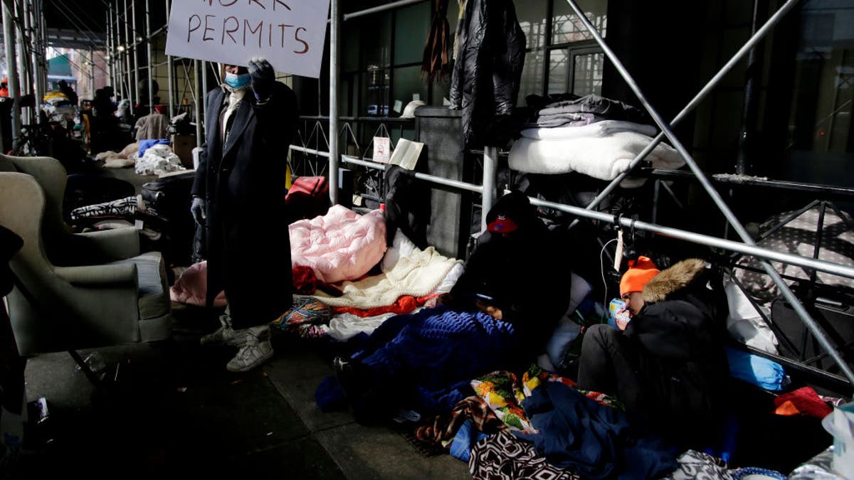 NYC migrants camped in front of hotel