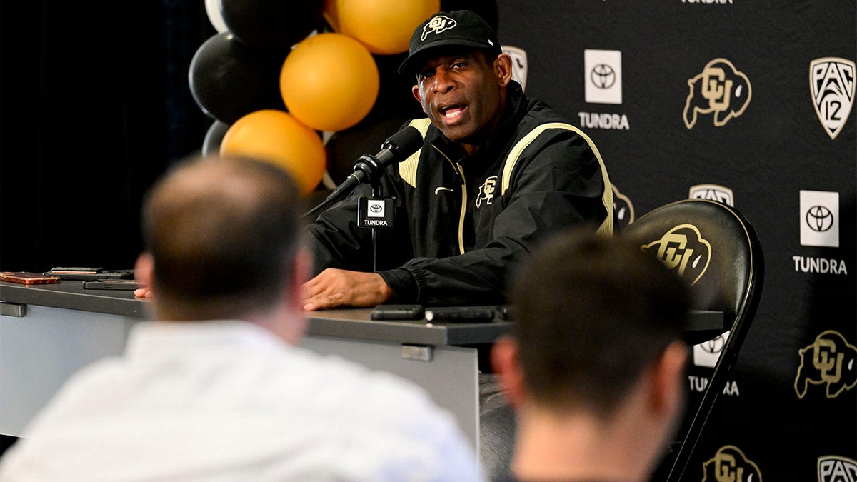 Colorado head coach Deion Sanders speaks to the media