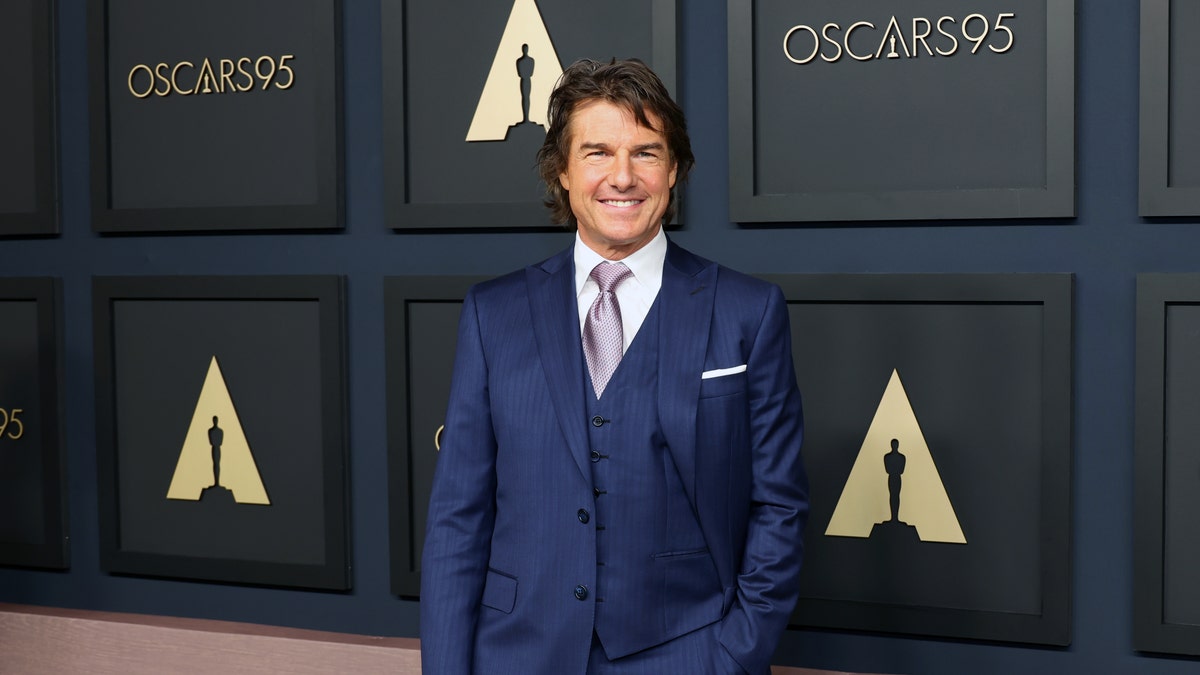 Tom Cruise in a blue suit from the waist up