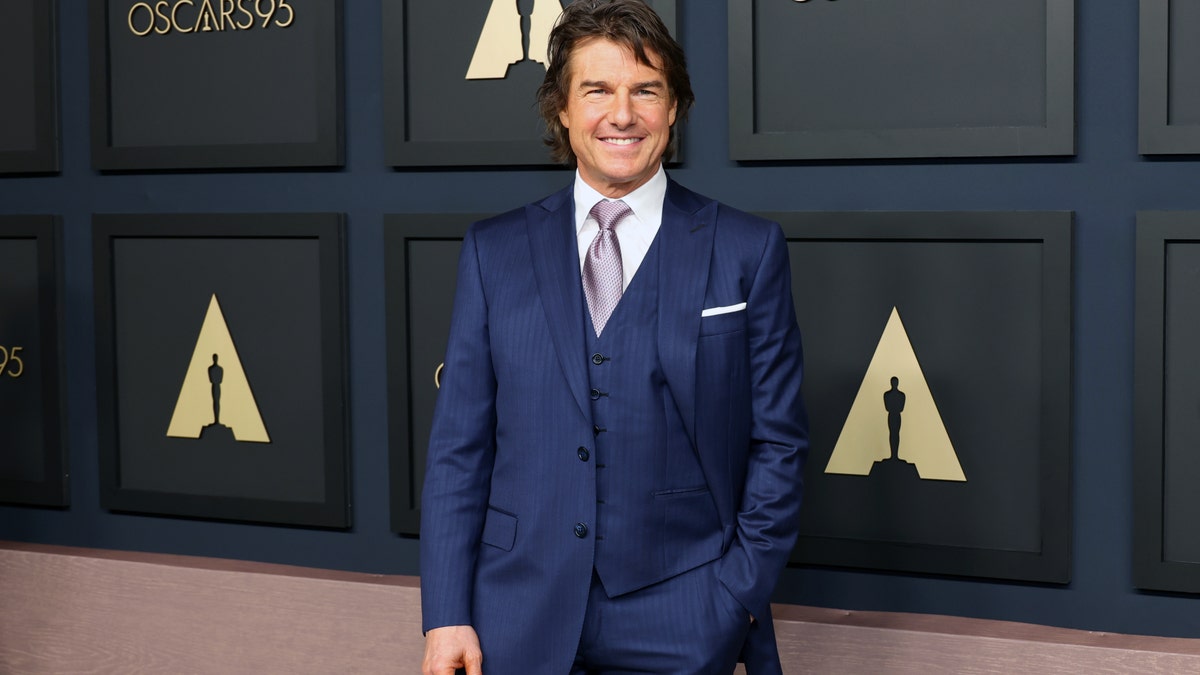 Tom Cruise in a blue suit from the waist up