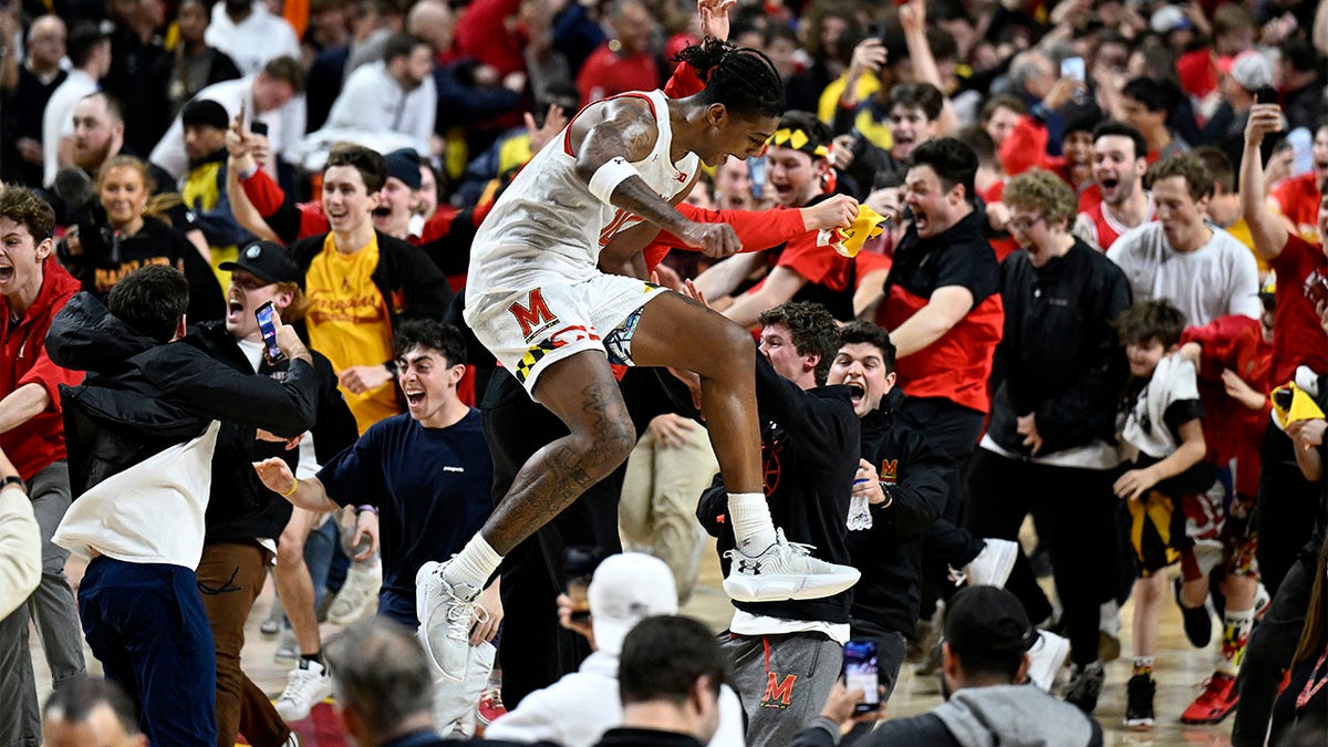 Julian Reese celebrates with fans after beating Purdue
