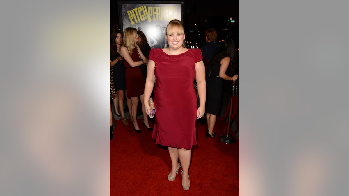 Rebel Wilson in a red dress on the red carpet