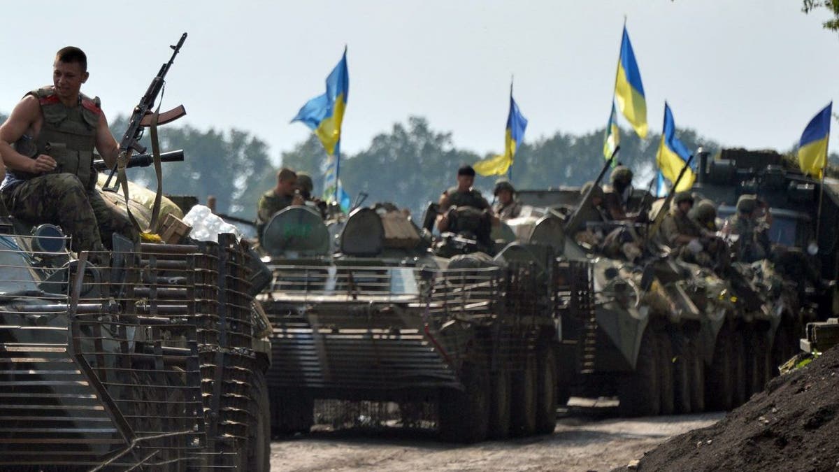Ukrainian troops on apcs