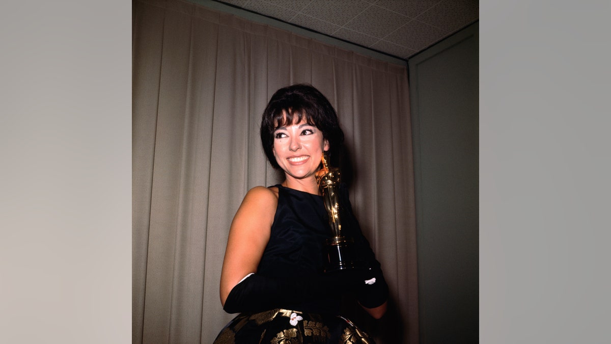 Rita Moreno holds her Academy Award