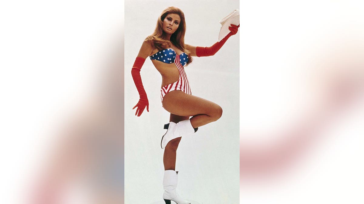 Raquel Welch poses in a skimpy American flag suit.