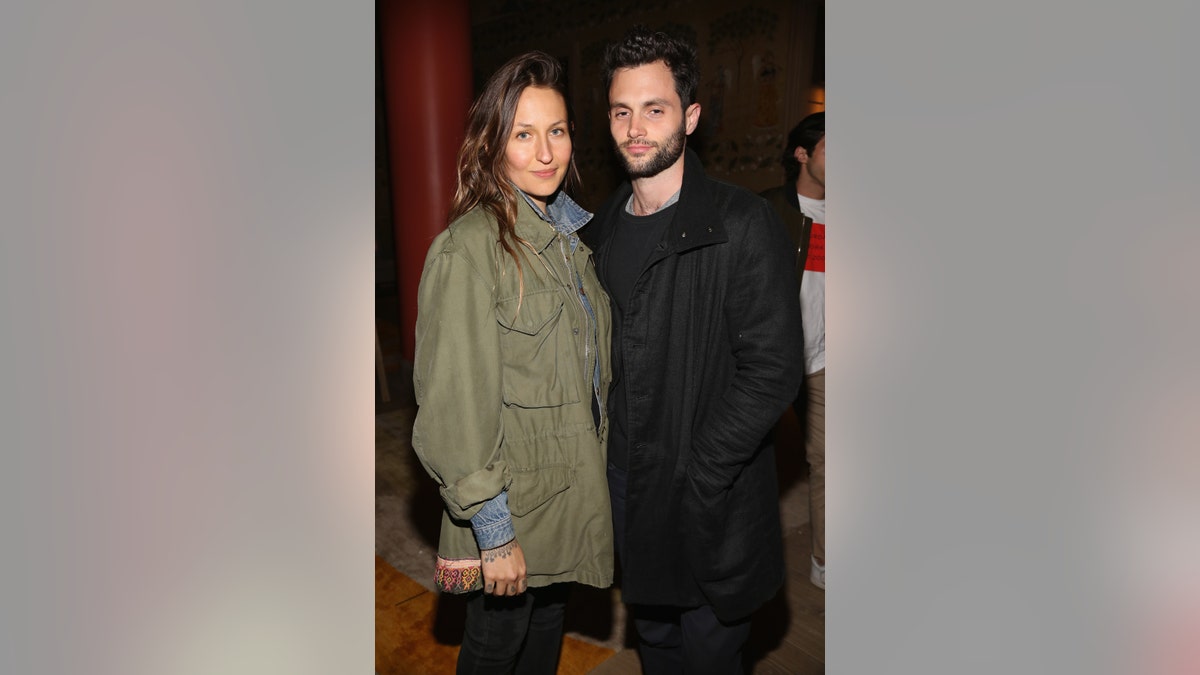 Penn Badgley poses for a photo with wife Domino Kirke.