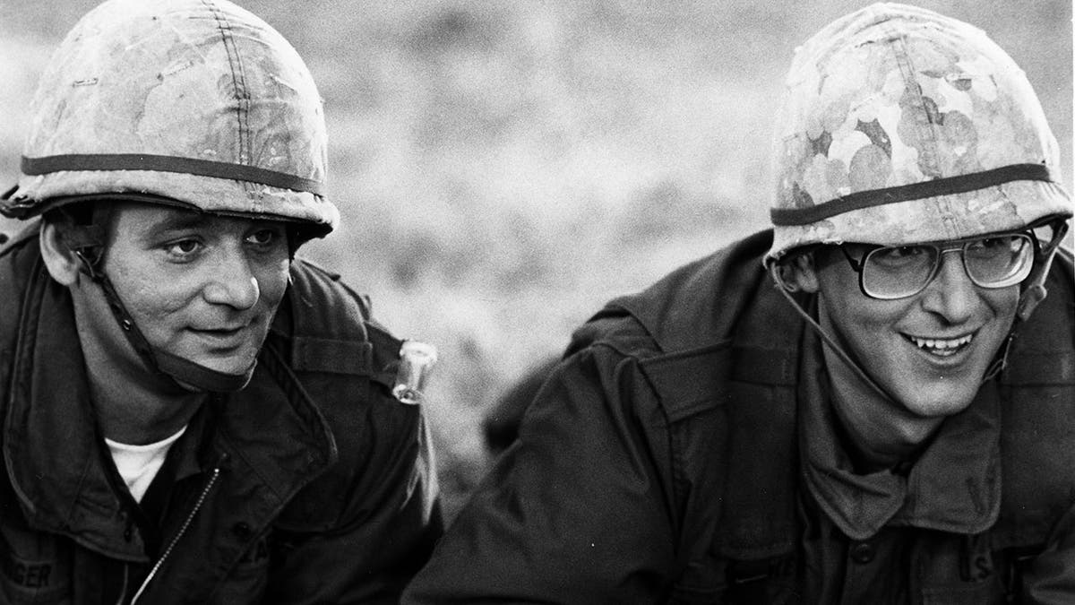 Bill Murray and Harold Ramis in 'Stripes,' a black and white photo of the men on the ground in combat hats