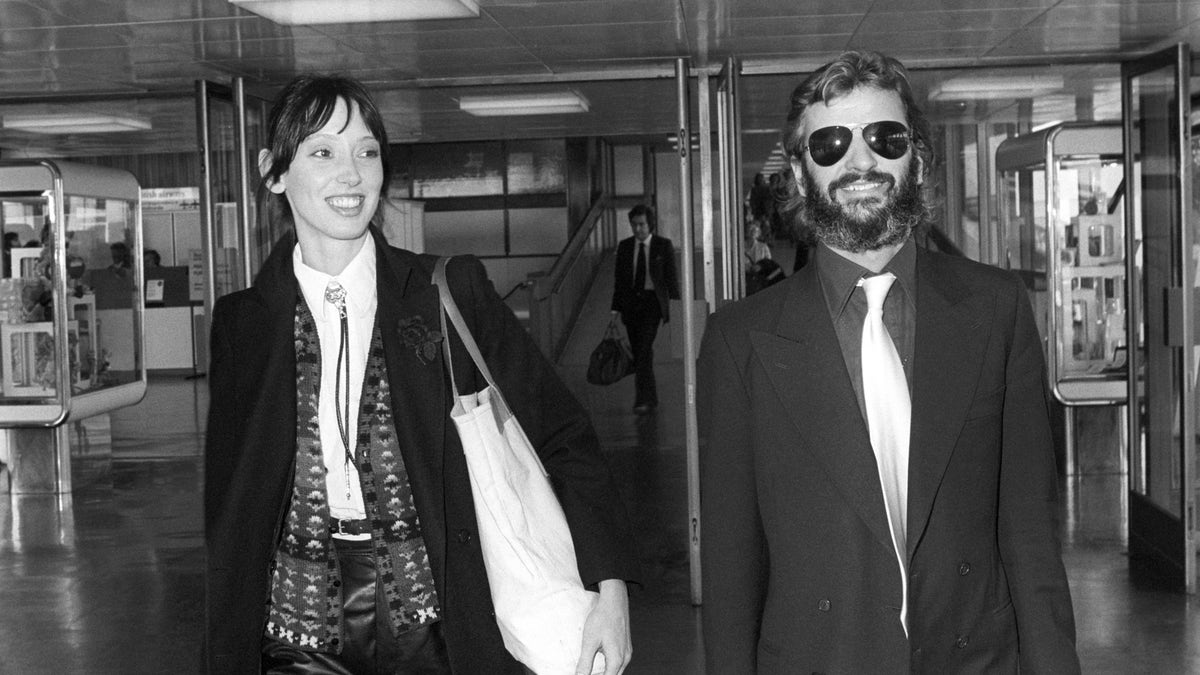 Former Beatles drummer Ringo Starr and his actress friend Shelley Duvall walking together