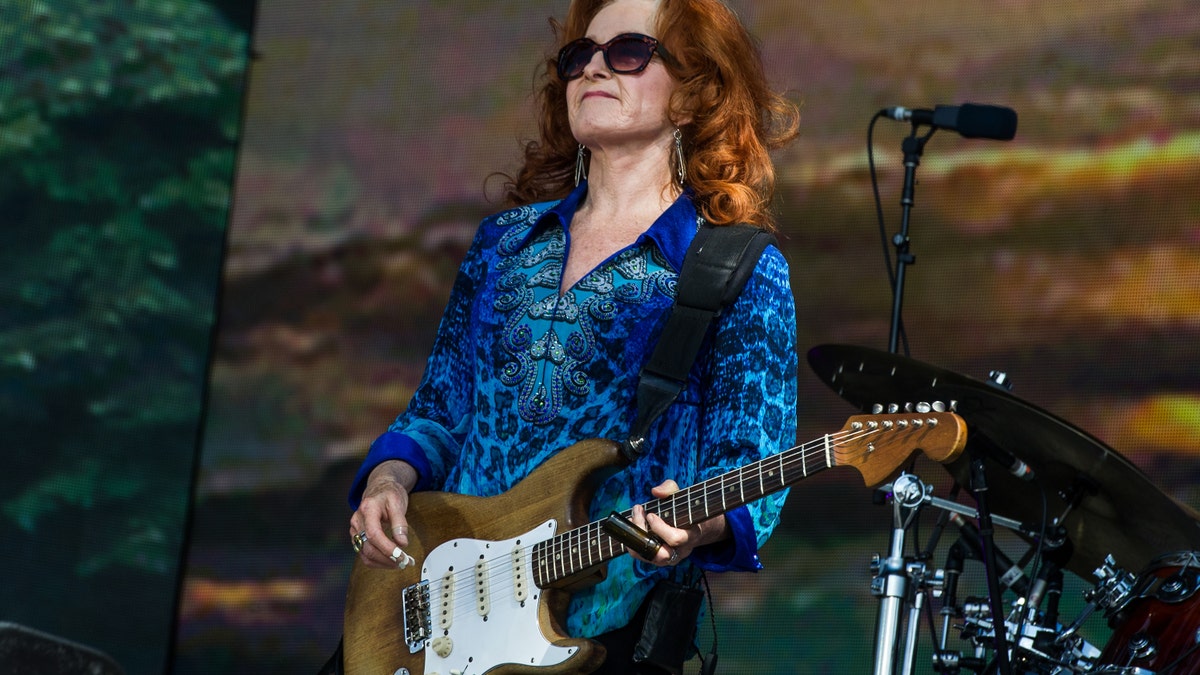 Bonnie Raitt performing on stage