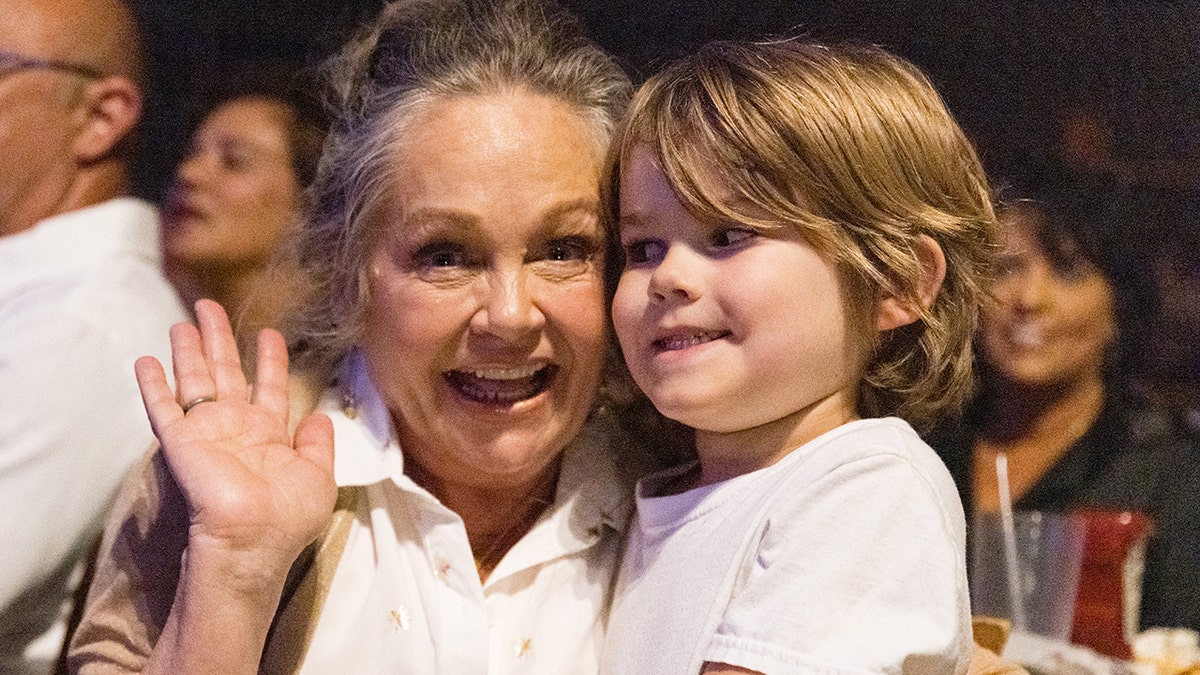 Charlene Tilton embracing her grandson