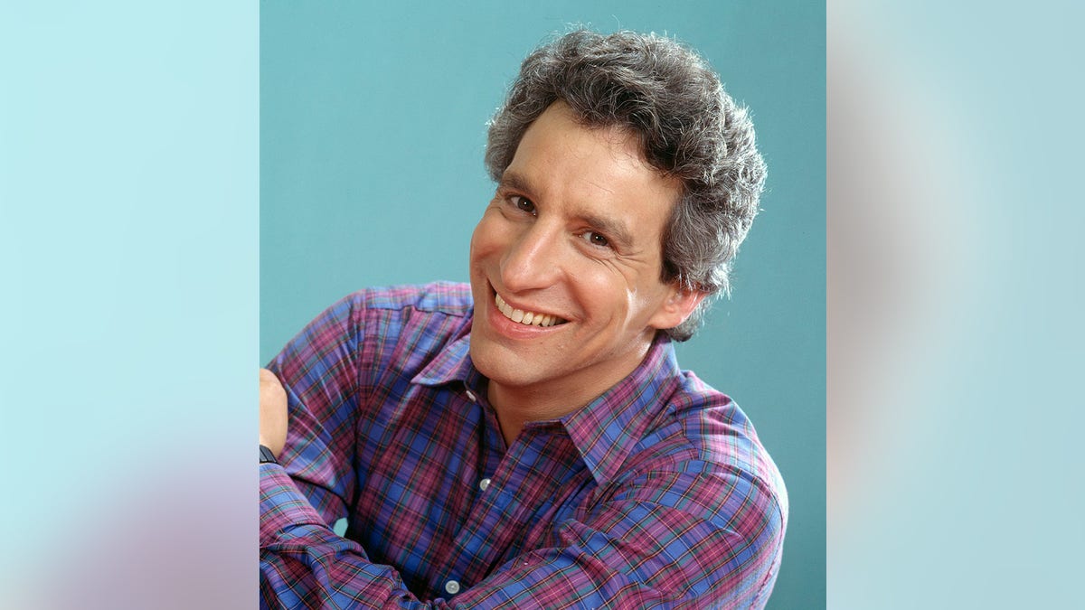 A smiling photo of Charles Levin from the '80s