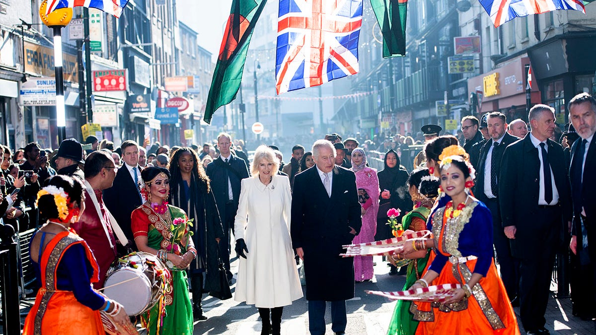 King Charles III and Camilla, Queen Consort meet members of the public during a visit to the Bangladeshi community of Brick Lane