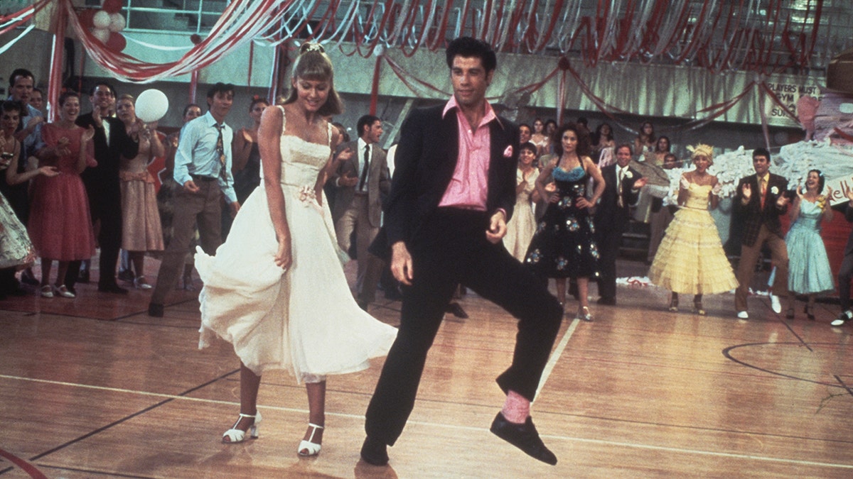 A scene of Olivia Newton-John and John Travolta dancing in Grease