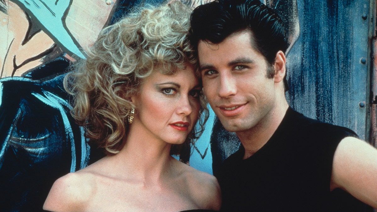 Olivia Newton John and John Travolta in costume for Grease