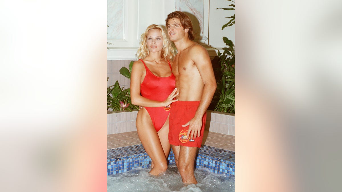 Pamela Anderson and David Charvett in their swimsuits for Baywatch