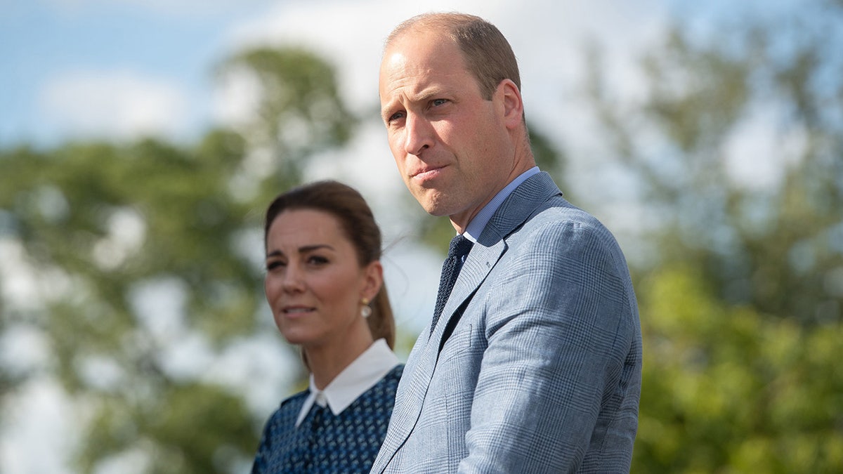 Kate Middleton and her husband Prince William looking serious at a royal event in the UK