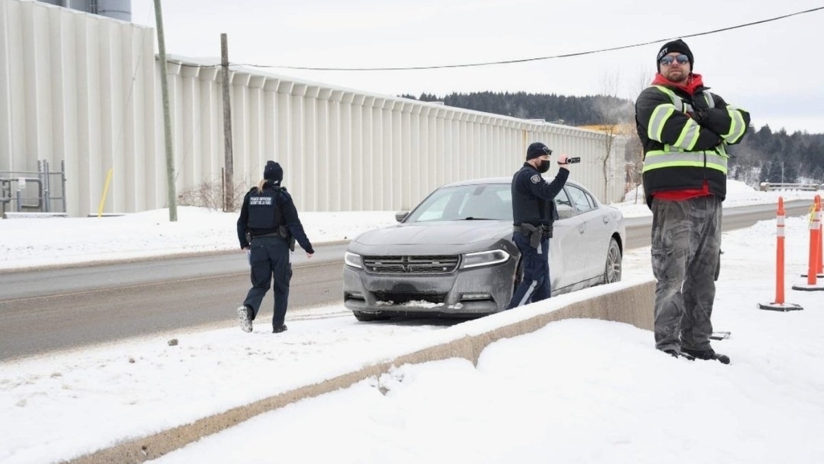 Canadian police taking pictures of church