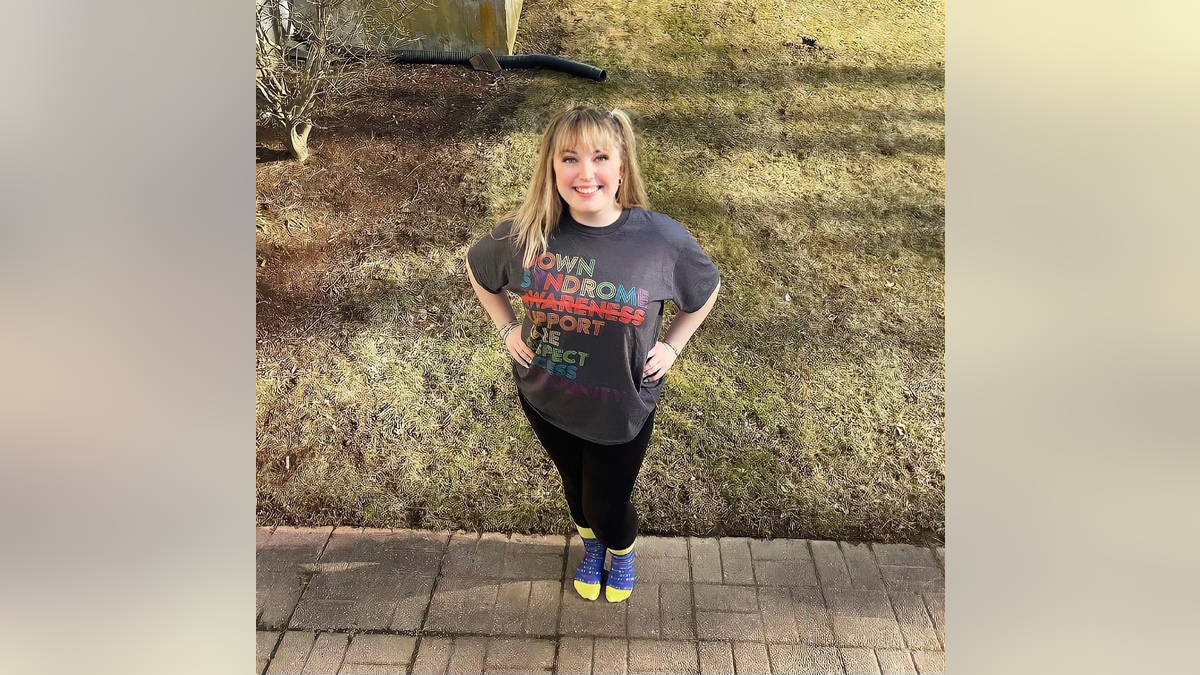 Laura Green poses with a down syndrome awareness shirt.